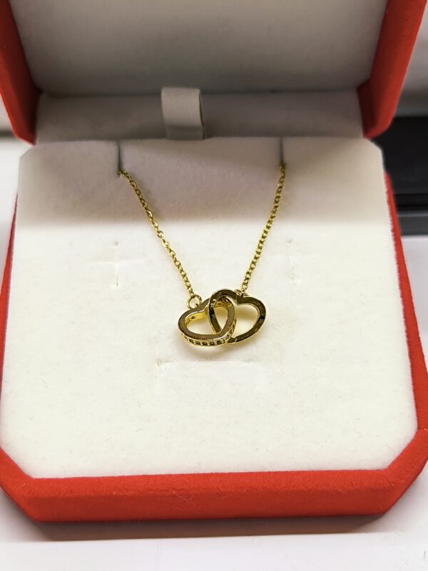 Collar doble corazón dorado ✨